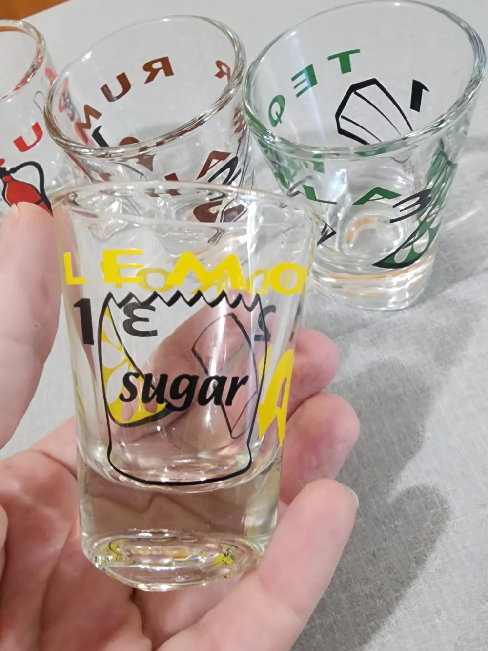 Clear Glass Shot Glasses with Multicolor Icons - Set of 4